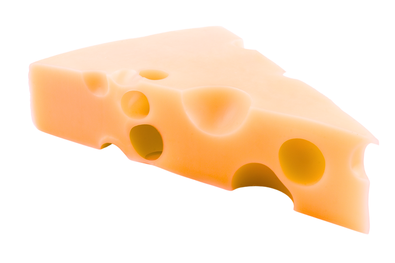 a piece of emmental cheese on a black background